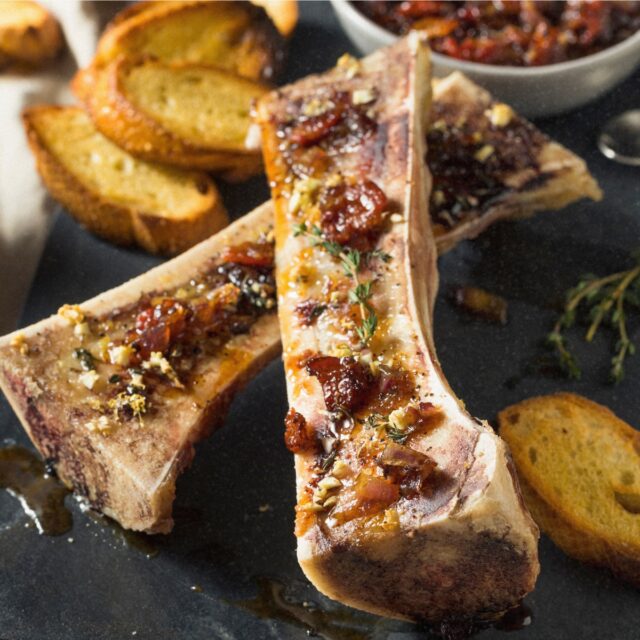 There's something deeply satisfying about eating bone marrow—it feels primal and luxurious at the same time. This ancient food, once the prize of our hunter-gatherer ancestors, has been rediscovered by modern restaurants as the ultimate indulgence.
When you roast marrow bones until the fat inside turns silky and butter-soft, then finish with bright, herbaceous gremolata, you get one of the most decadent yet surprisingly simple appetizers you can make.
Here's what might surprise you: this recipe requires exactly three ingredients for the marrow itself (bones, salt, pepper) and maybe 15 minutes of actual work. What you get is a dish that tastes like you spent hours in a Michelin-starred kitchen.
The gremolata is the secret weapon. Traditional Italian gremolata is just parsley, lemon zest, and garlic, but I've expanded it with fresh herbs and shallot to create something that cuts through the richness of the marrow perfectly. The brightness is essential—without it, bone marrow can feel heavy. With it, every bite is balanced and addictive.
The technique: high heat (450°F), short time (15-20 minutes), cut-side up. You want the marrow soft and wobbly but still holding its shape in the bone. Serve immediately with crusty toasted bread, topped with gremolata and flaky sea salt.
This makes an unforgettable first course that signals "this meal is going to be special." Perfect for winter dinner parties when you want something convivial and celebratory.
Recipe link in LinkTree or Searchable on Website 🍷 #bonemarrow #dinnerparty #entertaining #appetizer #frenchcooking #gremolata #specialoccasion #homecooking #restaurantquality #luxuryfood